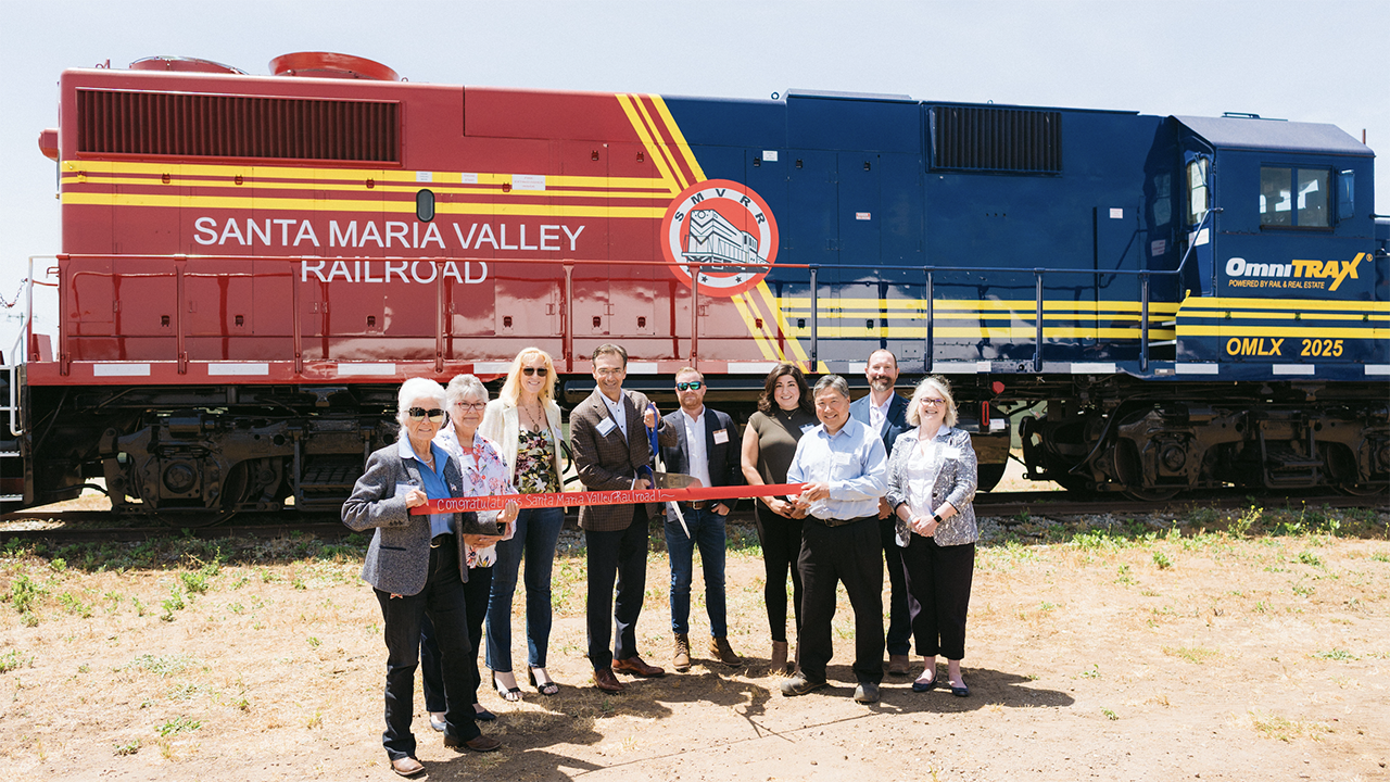 State and local partners join OmniTRAX officials to commemorate the new joint venture partnership operating the Santa Maria Valley Railroad. Left to Right: Alice Patino (Mayor of Santa Maria, Calf.), Vicki Conner (EconAlliance, Initiatives Director), Suzanne Singh (Santa Maria Chamber of Commerce, VP of Economic Development and Government Affairs), Dean Piacente (OmniTRAX, CEO), Scott Remington (OmniTRAX, Vice President, Corporate Development), Belinda Popovich (Santa Maria Valley Railroad, Assistant General Manager), Rob Himoto (Santa Maria Valley Railroad, President), Bob Nelson (County of Santa Barbara, Fourth District Supervisor), and Jenelle Osborne (EconAlliance, CEO). (Photograph Courtesy of OmniTrax)